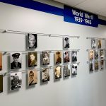 H1012 — World War II Veteran Memorial Wall Display Suspended with Rod Systems by Unity Medcenter